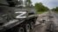 UKRAINE – The letter Z, which has become the Russian emblem for the war, is seen on a blown Russian APC near Kutuzivka, east Ukraine, May 13, 2022