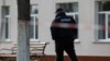 Ukraine -- Coronavirus. Policeman walk through the Kalynivka central hospital, city Kalynivka, Vinnitsa region, 16Apr2020