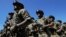 UKRAINE – Servicemen of the "Azov" regiment take part in a parade to mark the 5th anniversary of city's liberation from the Russian hybrid forces, on June 15, 2019 in Mariupol