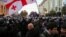 Tbilisi, Georgia - Riot police move to disperse demonstrators during a protest against the government demanding an early parliamentary election