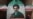 FILE PHOTO: A woman walks next to a banner with a picture of Iran's new Supreme Leader Mojtaba Khamenei in Tehran