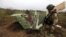 UKRAINE – Ukrainian military sapper inspects remains of a Russian Sukhoi Su-25 fighting aircraft hit by Ukrainian Armed Forces during Russia's invasion in Kyiv region, April 21, 2022