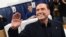 ITALY -- Silvio Berlusconi, leader of right-wing party Forza Italia, waves before to vote at a polling station in Milan, March 4, 2018