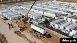 A still from a government video shows construction of the COVID-19 quarantine center from which a company connected to Construction Minister Batir Zakirov profited.