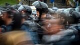 Servicemen of the Russian National Guard look on during a rally in central Moscow 