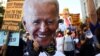 Washington, D.C., U.S. - A supporter holds a cardboard cutout of Democratic U.S. presidential nominee Joe Biden during a march from McPherson square to the White House after Election Day 