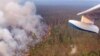 RUSSIA -- A picture taken from onboard a Be-200 firefighting aircraft shows a forest fire in the Boguchansky district, Krasnoyarsk Krai, Siberia, July 30, 2019