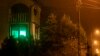 A green light shines in the window of a house in the city of Michalowo, near the Polish-Belarusian border, where an initiative encourages inhabitants to display a green light if they are willing to help migrants in search of food or refuge.