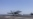 TOPSHOT - This US Navy handout photo released on May 6, 2026 by US Central Command Public Affairs shows an F/A-18E Super Hornet landing aboard Nimitz-class aircraft carrier USS George H.W. Bush (CVN 77) at sea on April 27, 2026.