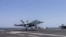 TOPSHOT - This US Navy handout photo released on May 6, 2026 by US Central Command Public Affairs shows an F/A-18E Super Hornet landing aboard Nimitz-class aircraft carrier USS George H.W. Bush (CVN 77) at sea on April 27, 2026.