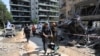 ISRAEL/A rescue personnel carries Tess, a dog rescued from a building that was hit following missile attack from Iran, in Ramat Gan, Israel