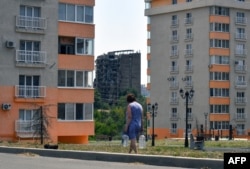 Улицы оккупированного Мариуполя, 14 июля 2025 года. Фото AFP