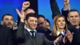 UKRAINE -- Presidential candidate Volodymyr Zelenskiy (C) and his wife Olena together with members of his crew react during a presidential election debate with Ukraine's current President at The Olympic Stadium in Kyiv, April 19, 2019