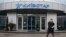 Ukraine -- A man walks out of an office of Kyivstar in Kyiv, March 6, 2014