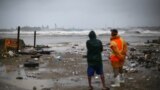 DOMINICAN REPUBLIC -- People look out to the sea as Hurricane Irma moves off the northern coast of the Dominican Republic, in Puerto Plata, Dominican Republic, September 7, 2017