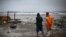 DOMINICAN REPUBLIC -- People look out to the sea as Hurricane Irma moves off the northern coast of the Dominican Republic, in Puerto Plata, Dominican Republic, September 7, 2017