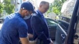 RUSSIA -- MOSCOW, RUSSIA - JULY 7, 2020: A plain clothes FSB security service officer detains Ivan Safronov (C), Head of Roscosmos Dmitry Rogozin's adviser, suspected of treason against the state. Best quality available. Video screen grab. Public Relation
