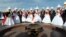 Kyrgyzstan -- Brides and bridegrooms take part in a mass wedding ceremony in the capital Bishkek, October 30, 2013