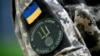 UKRAINE – The insigna of the International Legion for the Defence of Ukraine (LIDU) on the jacket of LIDU's spokesman in the Ukrainian capital Kyiv, amid the Russian invasion of Ukraine. Kyiv, June 8, 2022