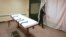 U.S. -- public information director of the Southern Ohio Correctional Facility, demonstrates how a curtain is pulled between the death chamber and witness room at the prison in Lucasville, Ohio. Nov. 2005