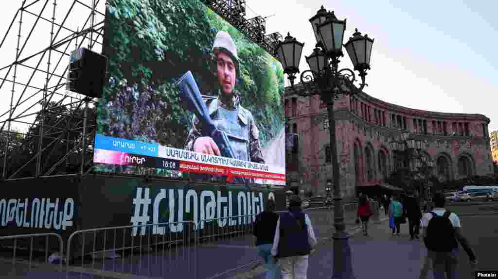 &nbsp;A screen placed on downtown Yerevan&#39;s Republic Square, not far from Armenian Prime Minister Nikol Pashinian&#39;s office, shows a state TV report on the war in Nagorno-Karabakh on October 9, 2020, as ceasefire talks began in Moscow. Although the Armenian government has not recognized its independence from Azerbaijan, Karabakh, predominantly inhabited by ethnic Armenians, is seen as an integral part of Armenia&#39;s heritage.&nbsp;