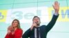 UKRAINE -- Ukrainian comic actor and presidential candidate Volodymyr Zelenskiy delivers a speech as his wife Olena applauds following the announcement of the first exit poll in a presidential election at his campaign headquarters in Kyiv, Ukraine March 3