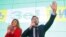 UKRAINE -- Ukrainian comic actor and presidential candidate Volodymyr Zelenskiy delivers a speech as his wife Olena applauds following the announcement of the first exit poll in a presidential election at his campaign headquarters in Kyiv, Ukraine March 3