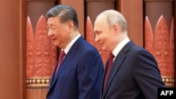 Владимир Путин и Си Цзиньпин на встрече в Пекине, 20 мая 2026, фото AFP