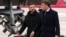 France's President Emmanuel Macron (R) and Ukraine's President Volodymyr Zelensky arrive to sign a letter of intent to buy up to 100 Rafale warplanes from France at the Villacoublay air base, in Velizy-Villacoublay, near Paris on November 17, 2025.