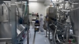 RUSSIA -- An employee wearing protective equipment works at the production line of Russia's biotech company BIOCAD, which is developing its own vaccine against the new coronavirus and working on another one in cooperation with the country's virus research