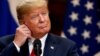 Helsinki, Finland - U.S. President Donald Trump / U.S. President Donald Trump adjusts his earphone during a joint news conference with Russian President Vladimir Putin (not pictured) after their meeting in Helsinki, Finland July 16, 2018. REUTERS/Grigory 