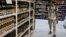 Ukraine -- A shopper looks at bottles of alcohol at a supermarket in Kyiv, June 19, 2017