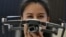 A hostess presents the Mavic 2 Pro drone at the booth of DJI during a preview day of the IFA, the world's leading trade show for consumer electronics and home appliances, in Berlin on August 30, 2018. / AFP PHOTO / Tobias SCHWARZ