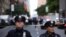 U.S. -- Police stand guard in a closed street after a bomb alert at the Time Warner offices in New York, New York, USA, 24 October 2018. 