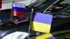 GERMANY -- Flags mounted on the official cars are seen during a Normandy Format meeting of foreign ministers from France, Germany, Ukraine and Russia on the conflict in Ukraine, in Berlin on June 11, 2018