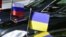 GERMANY -- Flags mounted on the official cars are seen during a Normandy Format meeting of foreign ministers from France, Germany, Ukraine and Russia on the conflict in Ukraine, in Berlin on June 11, 2018