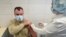 RUSSIA -- A Russian Army service member receives an injection with Sputnik V (Gam-COVID-Vac) vaccine against the coronavirus disease (COVID-19) at a clinic in the city of Rostov-On-Don, Russia December 22, 2020.
