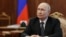 In this pool photograph distributed by the Russian state agency Sputnik, Russia's President Vladimir Putin attends a meeting with the Kaliningrad region governor in Moscow on July 2, 2026. (Photo by Gavriil Grigorov / POOL / AFP)