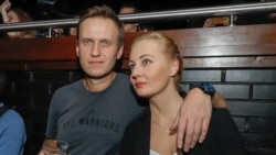 RUSSIA -- Russian opposition leader Aleksei Navalny (L) and his wife Yulia attend a concert of Russia's top rappers in support of rapper Husky, whose real name is Dmitry Kuznetsov, at a Moscow club, November 26, 2018