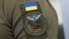 UKRAINE – A patch on the uniform of Andriy Yusov, a representative of the Main Intelligence Directorate (GUR) of the Ministry of Defense of Ukraine, during a meeting with journalists regarding the killing of prisoners in Olenivka. Kyiv, August 3, 2022 