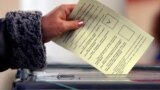 Ukraine - woman casts her ballot during the referendum