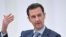 Russia -- Syrian President Bashar al-Assad gestures during a meeting with Russian President at Moscow's Kremlin, October 20, 2015