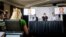 NETHERLANDS -- Eliot Higgins (C), founder of online investigation group Bellingcat, addresses a press conference on findings in research on Malaysia Airlines flight MH17 in Scheveningen, May 25, 2018