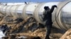 Коронавирусом заразились 23 рабочих "Газпрома" и 290 – НОВАТЭКа
