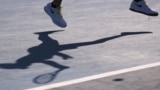 Australia -- Britain's Katie Boulter casts her shadow on the court as she plays against Ukraine's Elina Svitolina during their women's singles match on day two of the Australian Open tennis tournament in Melbourne on January 21, 2020