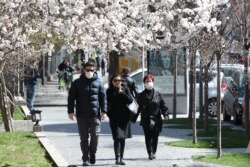 These pedestrians took advantage of a sunny spring day in March 2020 to walk in the streets of Yerevan, the Armenian capital.