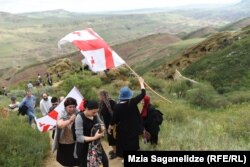Carrying Georgian flags, Georgians trekked to Davit Gareji in May 2019 to protest Azerbaijan's claims to the monastery complex's territory.