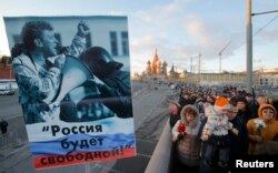 A poster at a February 27, 2016 memorial demonstration for Boris Nemtsov in Moscow reads ‘Russia will be free!’.