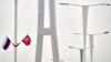 RUSSIA -- Flags of Russia and North Korea are seen fixed on a lamp post on Russky island in the far-eastern Russian port of Vladivostok, April 23, 2019