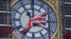 U.K. - The British union flag is seen fluttering as the clock face of Big Ben shows eleven o'clock, London, January 30, 2020